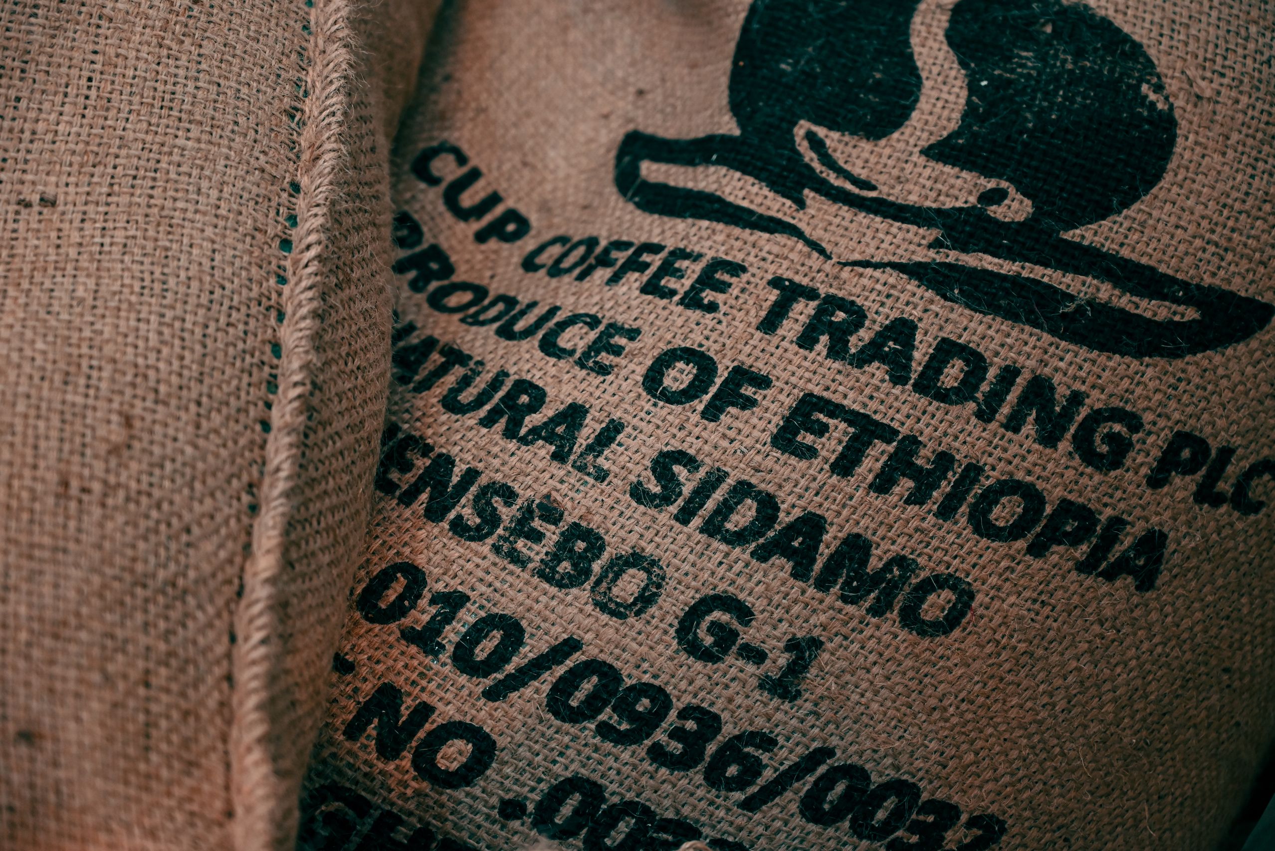 Burlap sacks with logo and coffee beans